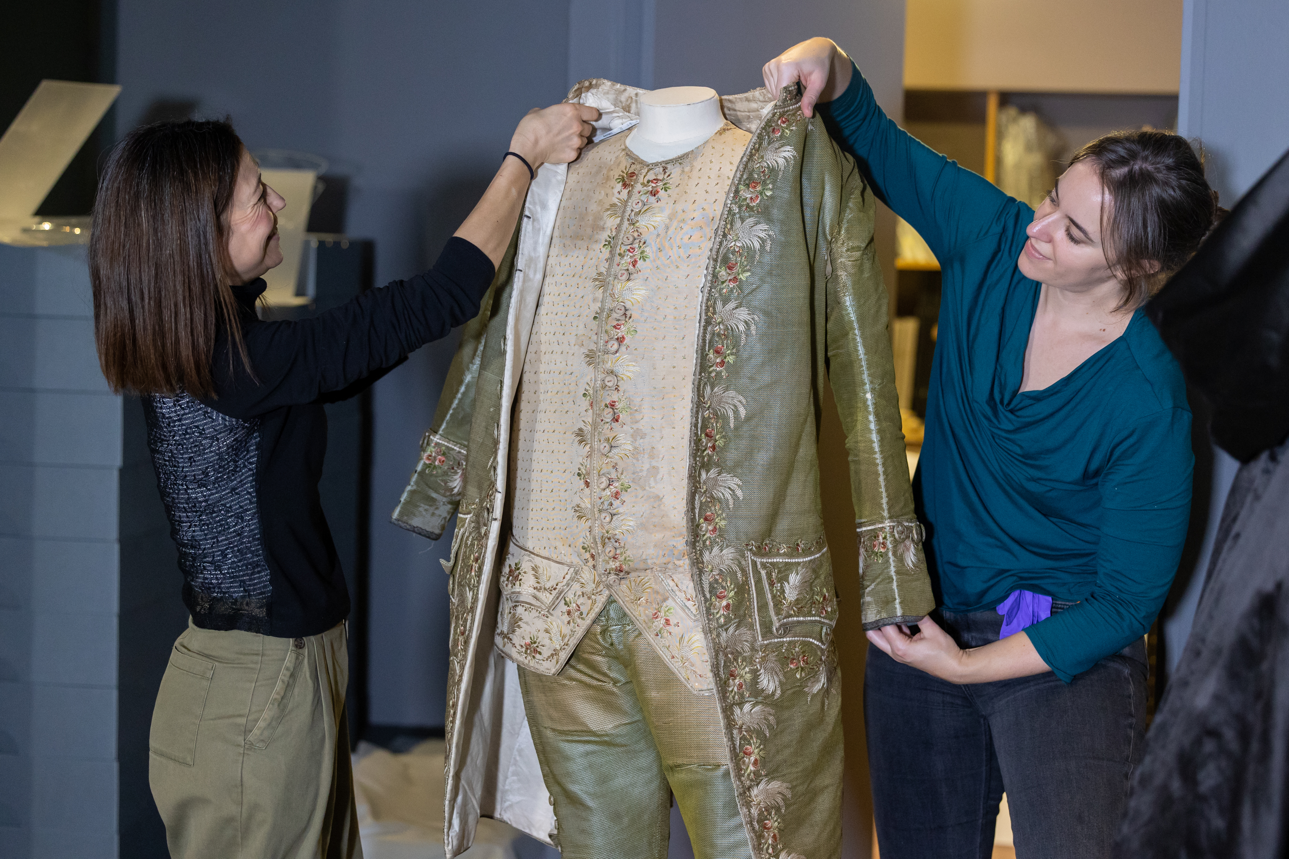 Image: Curators removing items from the displays