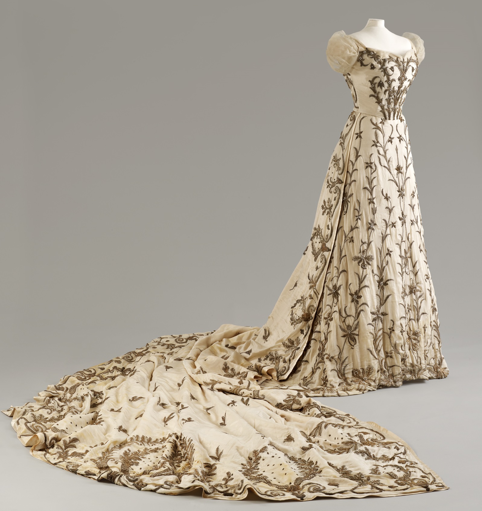 Image: Cream silk court dress with silver and gold metal thread zardozi embroidery by the House of Worth, worn by Lady Curzon, Vicereine of India, ca. 1903-1905