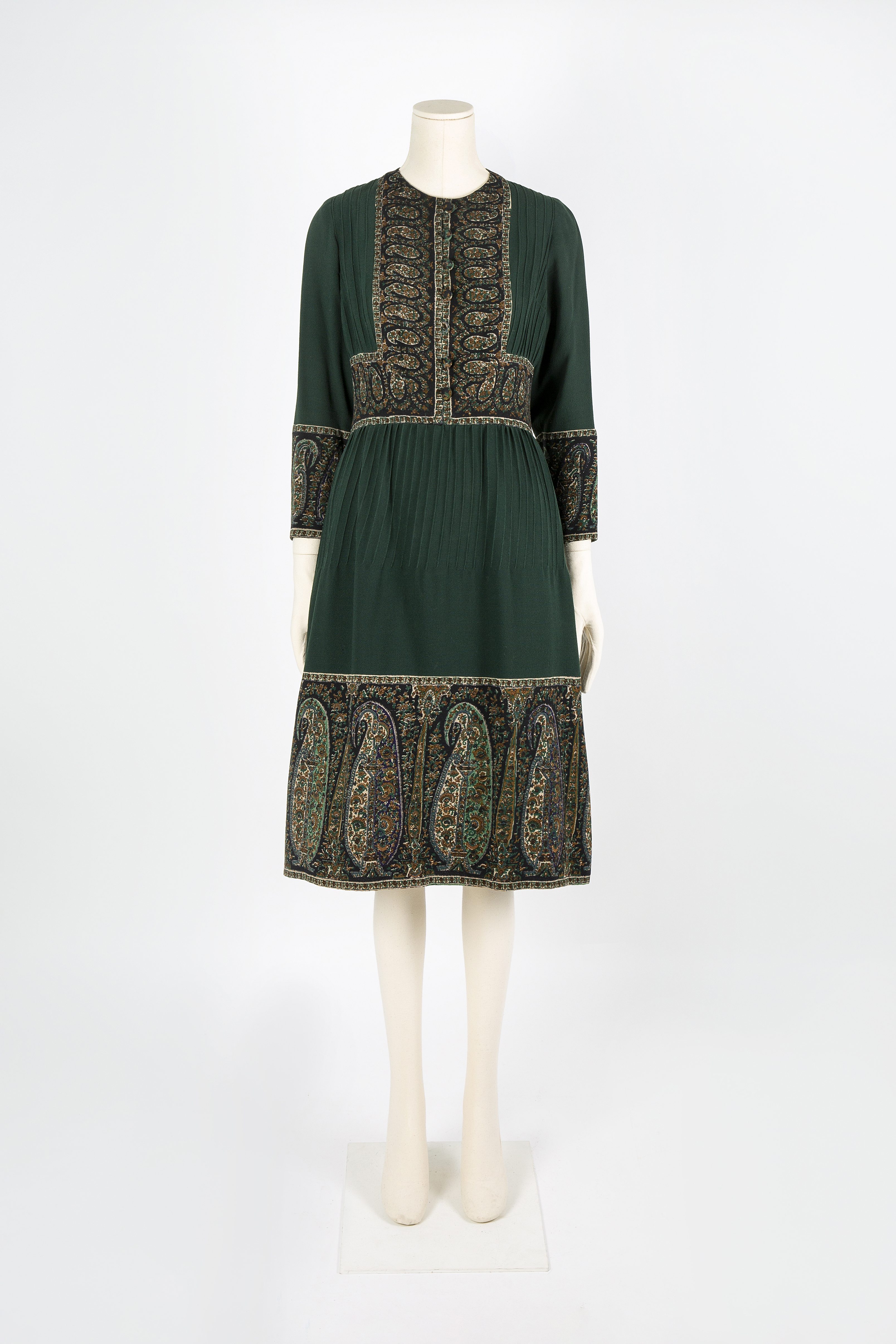 Dark green dyed fur ‘Jaipur’ coat with frogging detail and green printed wool dress with Paisley design by Bellville Sassoon, Autumn/Winter 1970