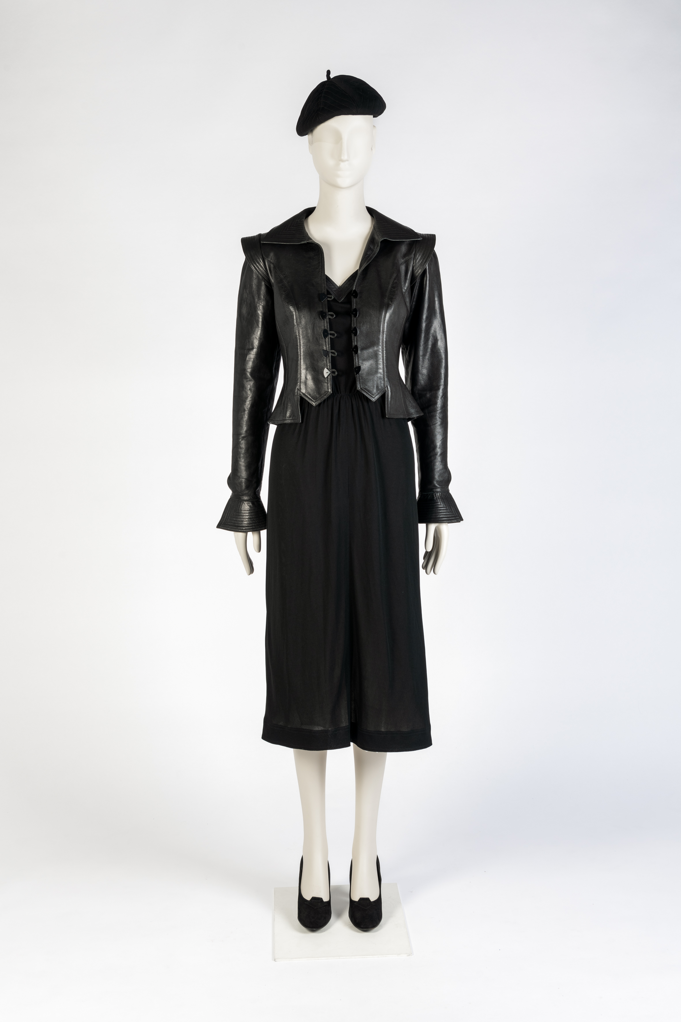 Black silk jersey dress, black tailored leather jacket and black beret by Jean Muir and black suede leather shoes by Manolo Blahnik for Zapata