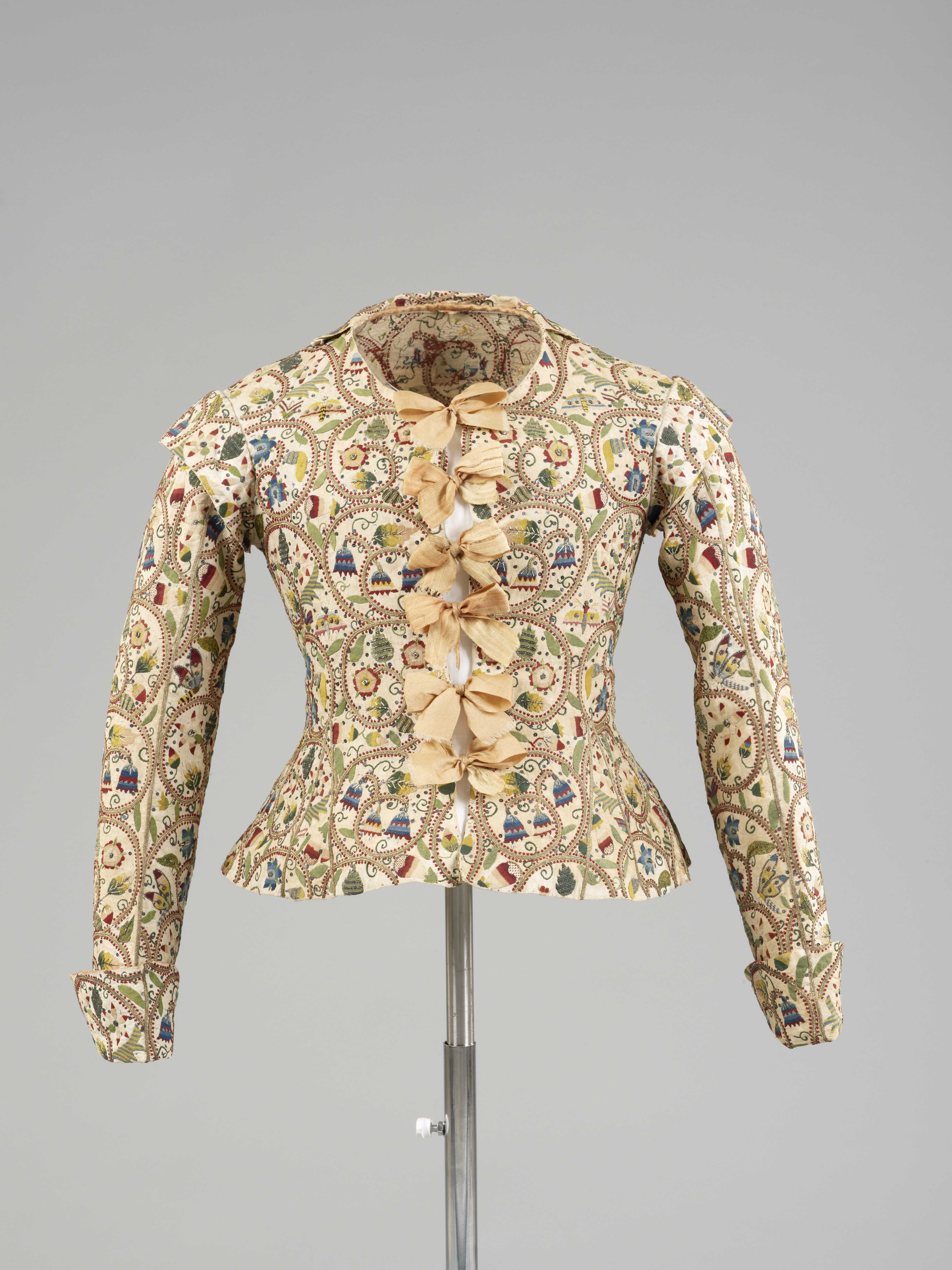 Cream linen woman’s waistcoat with coloured silk and metal thread embroidery