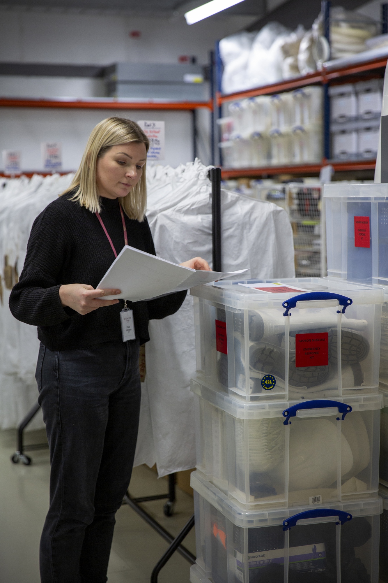 A Fashion Museum Bath staff member at the collections store monitoring the collection