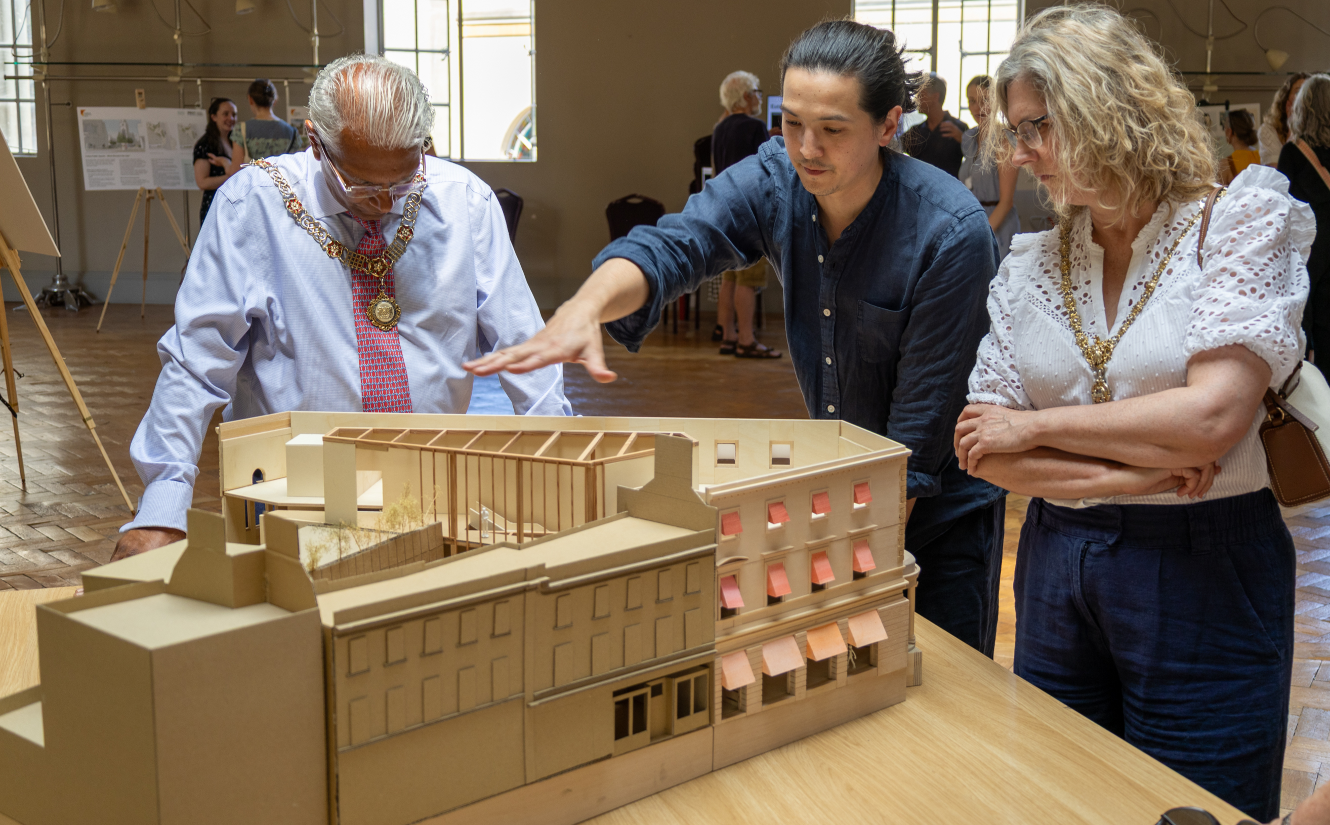 Architects from 6a showing visitors a scaled model of the new Fashion Museum Bath