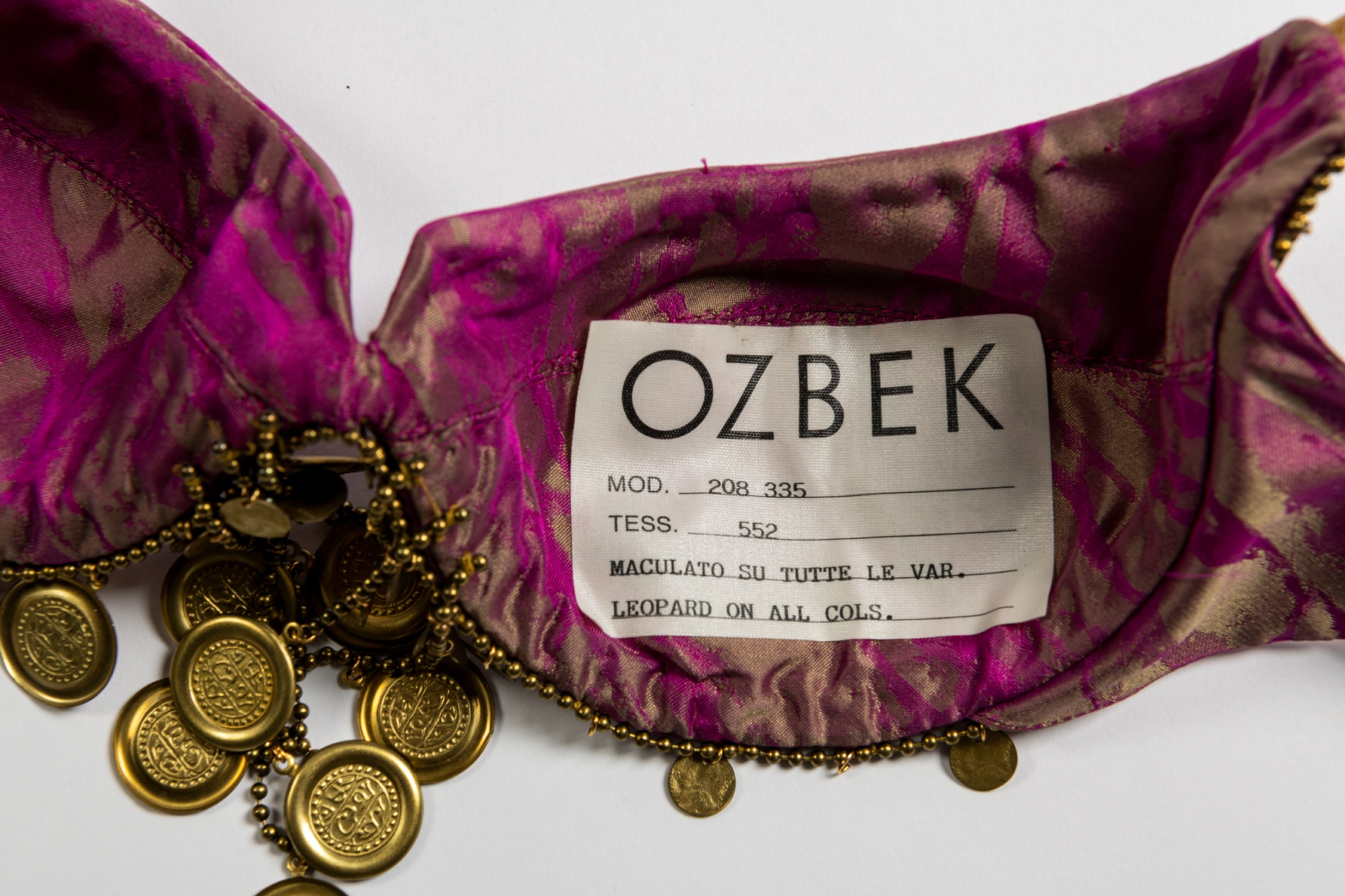 A close-up of an Ozbek label inside a bra cup