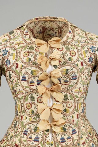 Cream linen woman’s waistcoat with coloured silk and metal thread embroidery