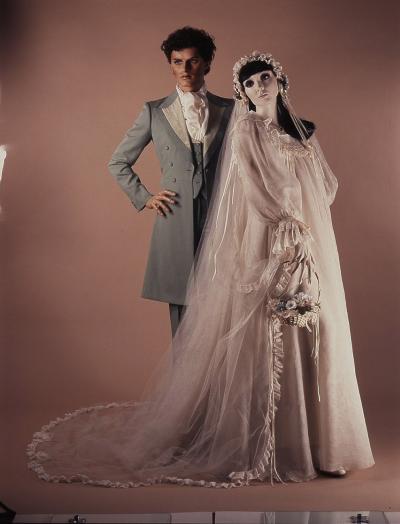 1975 Gina Fratini, Tommy Nutter: Wedding dress; man’s frock-coat, brogues by The Chelsea Cobbler. Selector: Anna Harvey, Brides