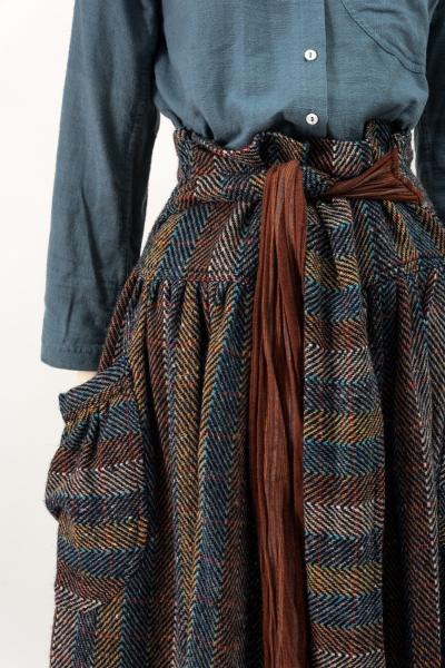 3 Woman's ensemble: skirt, waistcoat, jacket, trousers, shirt, shawl