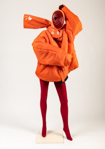 Blood orange satin padded bomber jacket, PVC trousers (worn as scarf), hoodie, bodysuit and mask