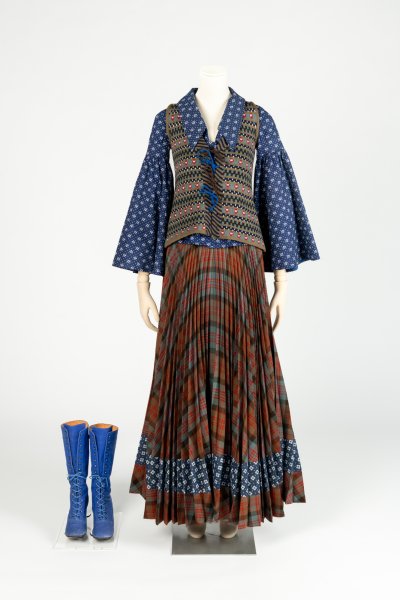 Plaid wool skirt, cotton blouse, waistcoat and boots