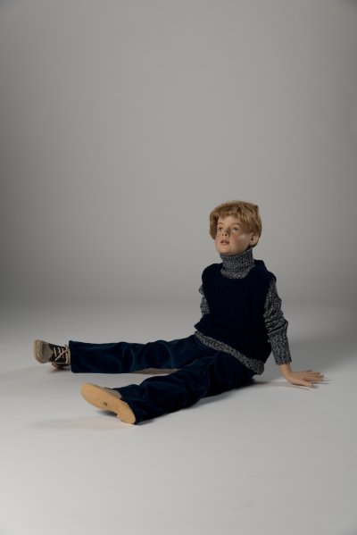 Boy’s navy blue corded trousers, roll neck jumper and tank top