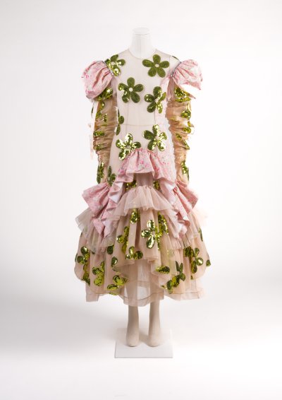 White tulle dress and gloves with pink and green printed silk panels and large green sequin daisies, S/S 2023