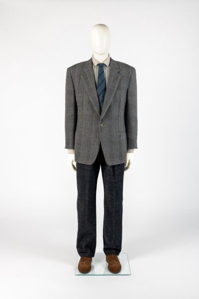 Man’s soft tailored wool suit worn with brogues