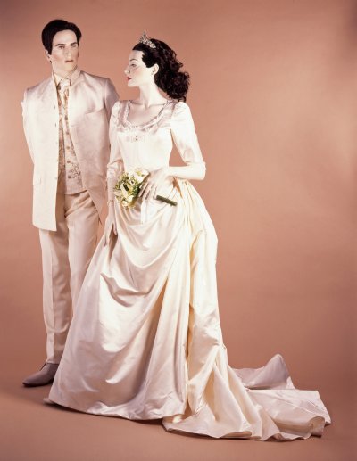 Beaded ivory silk satin wedding dress. Shoes by Emma Hope. Man’s ivory silk damask Nehru jacket, wool trousers and embroidered waistcoat.